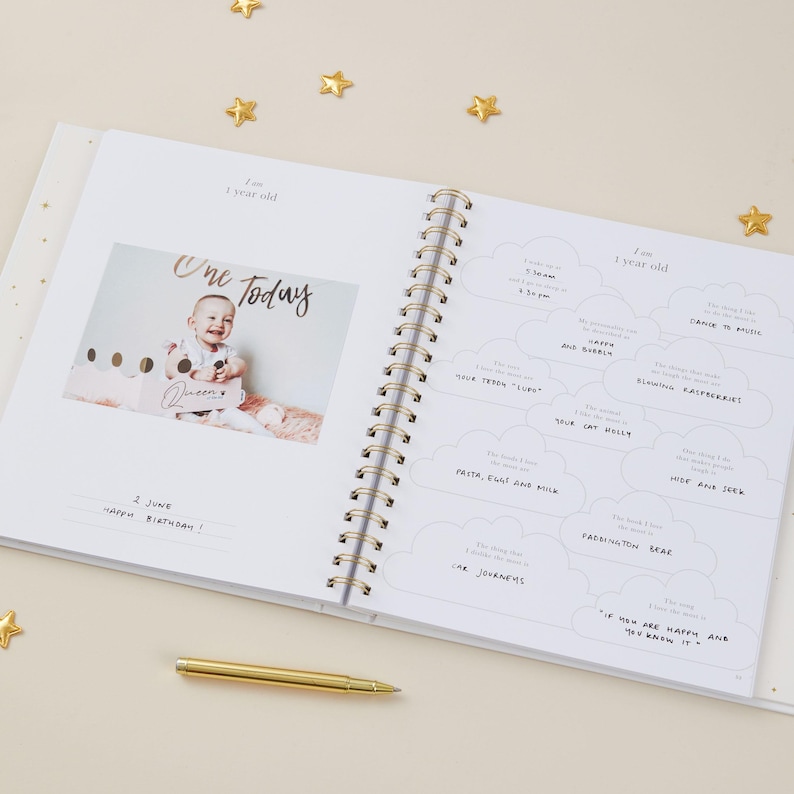Aqua baby milestone book with elegant light blue cover and gold foil design. This gender-neutral baby record book includes 114 guided pages with prompts for capturing milestones and special memories from pregnancy through to a child’s fifth birthday. With space for personal notes and photographs, it becomes a treasured keepsake. Supplied in a luxury foiled gift box, this aqua baby journal is the perfect baby shower or newborn gift.