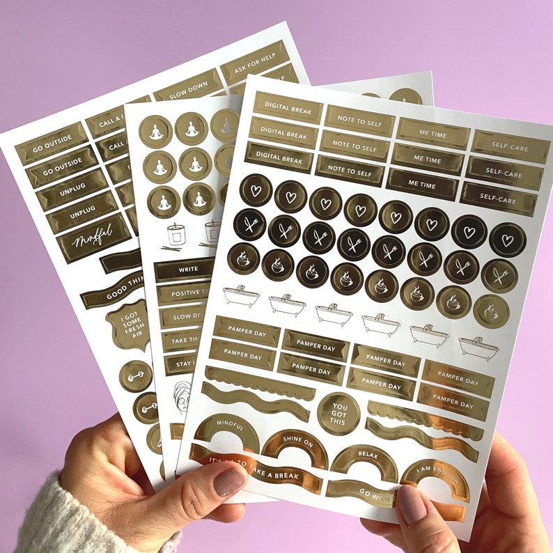 May include: Gold foil stickers with various phrases and designs, including "Go Outside", "Digital Break", "Pamper Day", "Mindful", and "You Got This".