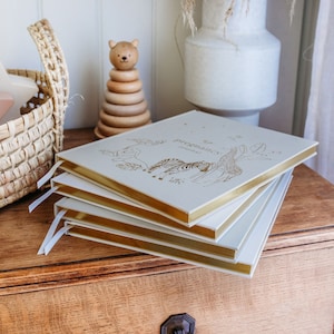 Luxury pregnancy journals with fabric covers and gold details