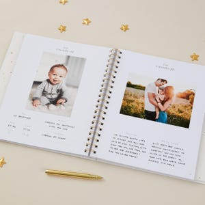 Light blue baby journal with gold foil details, designed to record memories from pregnancy to age 5. Featuring 114 pages of guided prompts and plenty of space for personalisation, this baby memory book helps capture milestones such as first words, first steps, and birthdays. Gender-neutral and inclusive, it is suitable for all families. Presented in a foiled matching box, this keepsake record book makes a beautiful baby shower present.