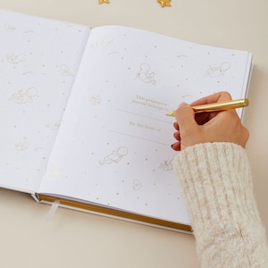 Pregnancy diary for mums-to-be with cute gold details of animals on the cover