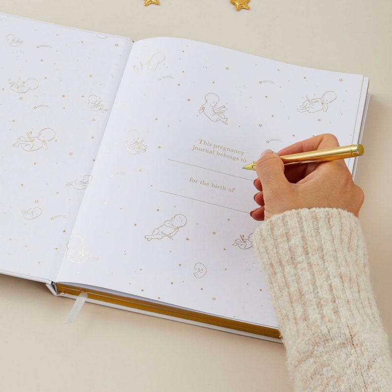 Pregnancy diary for mums-to-be with cute gold details of animals on the cover