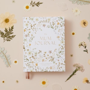 Wildflower mum journal featuring delicate watercolour floral illustrations, designed as a five year memory book to record everyday motherhood moments and reflections over time.