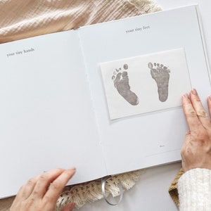 Pregnancy journals with space for handprints and footprints