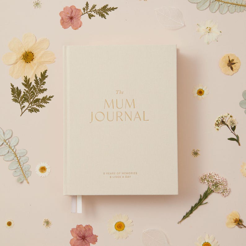 Ivory cloth mum journal designed as a five year memory book for recording motherhood moments