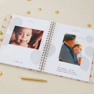 Gender neutral baby memory book with delicate, pastel designs