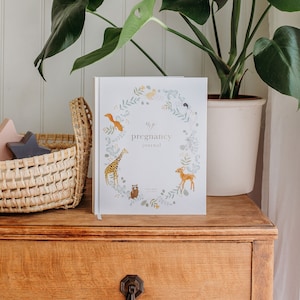 Cherish your pregnancy journey with our lovely journal, adorned with cute animals and stunning gold accents. A perfect keepsake for expecting moms!