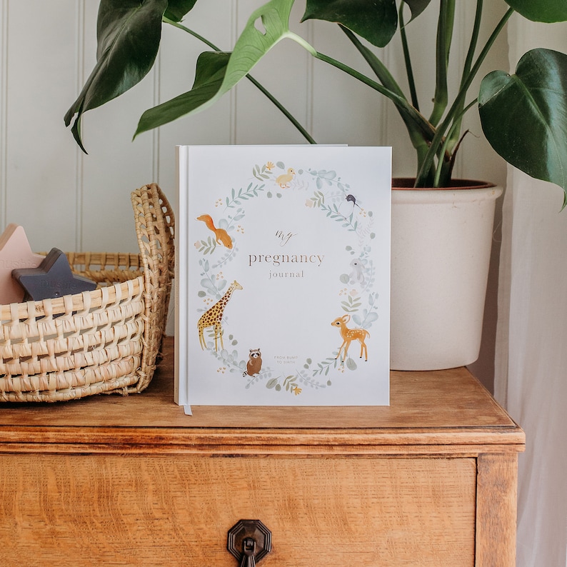 Cherish your pregnancy journey with our lovely journal, adorned with cute animals and stunning gold accents. A perfect keepsake for expecting moms!