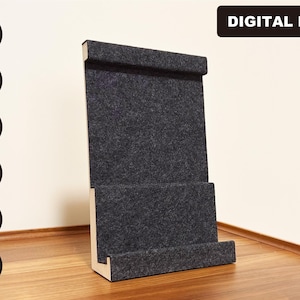 May include: A gray felt phone stand with a wood frame. The stand has two levels for holding phones or other devices. DIGITAL FILE is written in black text at the top of the image.