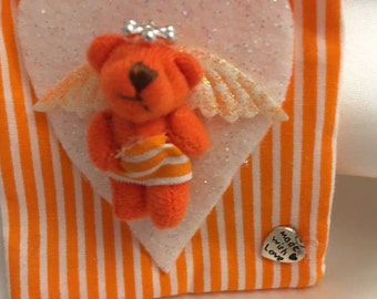 Scented pouch with teddy bear angel decoration