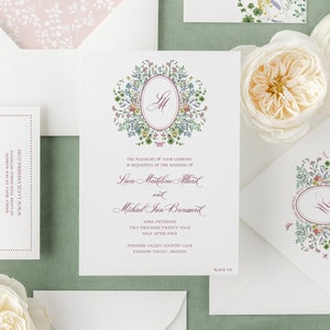 Wildflower monogram crest wedding invitation. Elegant vintage floral wedding invitation in rose pink.