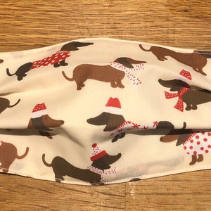 Handmade cotton fabric face mask dachshunds in Christmas jumpers