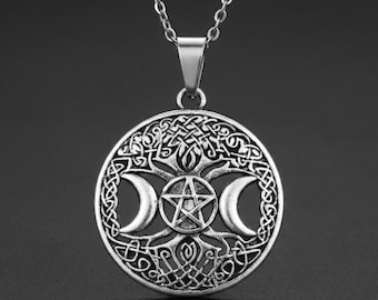 May include: Silver-toned pendant necklace featuring a circular design with a pentagram, crescent moons, and intricate knotwork. The pendant hangs from a delicate chain, showcasing a celestial and mystical theme. The necklace is suitable for everyday wear.