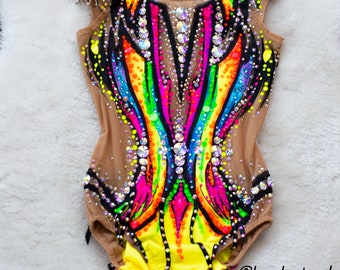 May include: A colorful leotard with a rainbow design and black accents. The leotard is made of a sheer fabric with rhinestones and is decorated with a yellow trim. The leotard is designed for gymnastics or dance. @leo_leotard by Nataly  Zrazhevksa