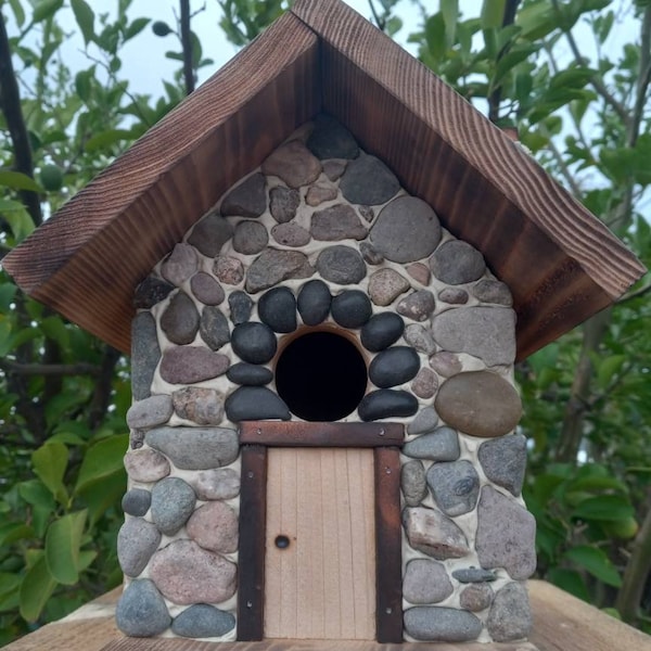 Bird house with stone front and stone covered chimney