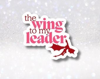 May include: Pink and white sticker with the text "the wing to my leader" and a red dragon silhouette.