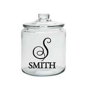 May include: Clear glass jar with a black cursive "S" and the word "SMITH" printed on the front.