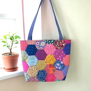 May include: A set of three ceramic mugs with a speckled, matte finish. The mugs are in shades of cream, light gray, and dark gray. Each mug has a simple, minimalist design, perfect for coffee or tea.