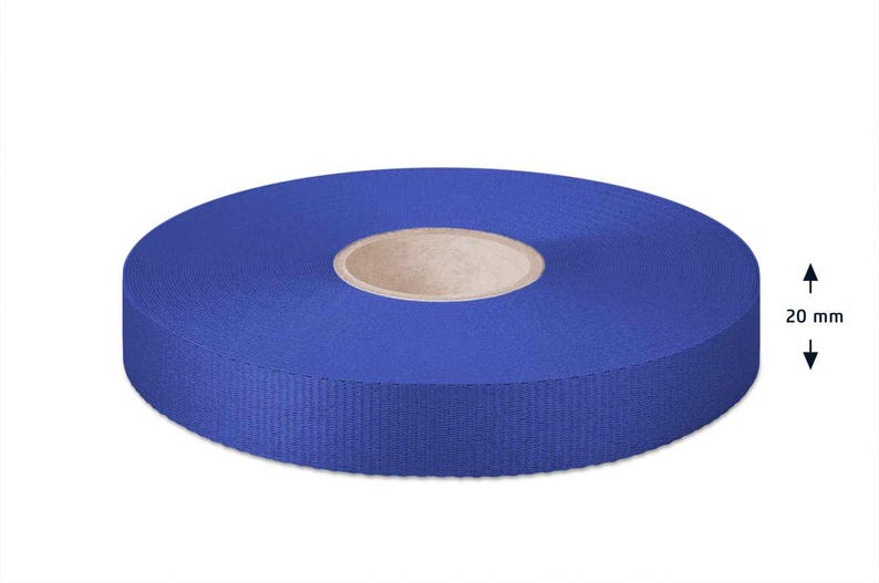 May include: A roll of 20 mm wide blue ribbon. The ribbon is wound around a cardboard core.