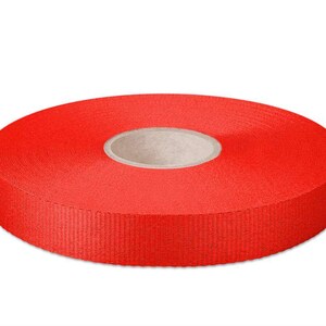 May include: A roll of bright red ribbon, 20 mm wide.