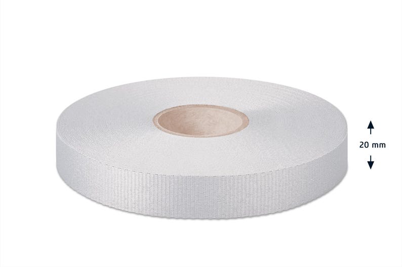 May include: A roll of white, 20 mm wide, woven ribbon.
