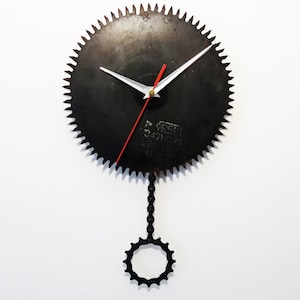 Circular saw wall clock, pendulum clock