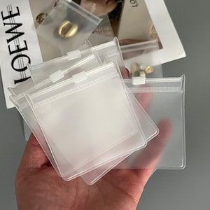 100カスタムジュエリーポーチ、PVC透明ジッパーバッグ、カスタマイズされた高品質のジュエリーパッケージ、ロゴ入りカスタムジュエリーバッグ