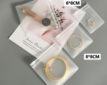 Bolsa de joyería con logotipo personalizado de 100 piezas, bolsa para pulseras, bolsa para collares, bolsa para anillos, bolsa de embalaje transparente