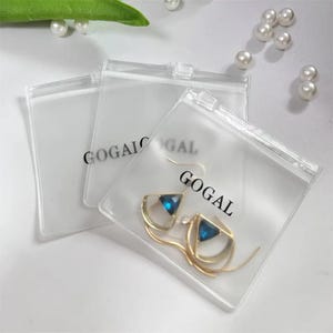 100カスタムジュエリーポーチ、PVC透明ジッパーバッグ、カスタマイズされた高品質のジュエリーパッケージ、ロゴ入りカスタムジュエリーバッグ