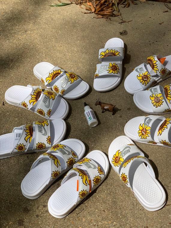 nike sunflower flip flops