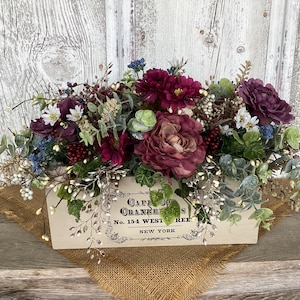 May include: A set of three ceramic mugs with a speckled, matte finish. The mugs are in shades of cream, light gray, and dark gray. Each mug has a simple, minimalist design, perfect for coffee or tea.