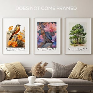 May include: Three framed prints with the word "MONTANA" in white text on a black background. The prints feature a bird, a flower, and a pine tree. The prints are displayed on a wall above a gray couch.