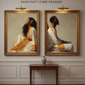 May include: Two framed portraits of people in traditional attire, with gold frames and warm lighting. The text "DOES NOT COME FRAMED" is above the portraits. A small wooden table and a decorative vase are below the portraits.
