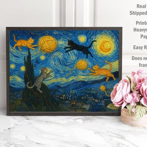 May include: A framed art print depicting a whimsical scene of cats playing with yarn balls against a starry night backdrop. The artwork features orange, black, and gray cats, with yellow yarn balls and a blue and yellow night sky. The print is unframed.