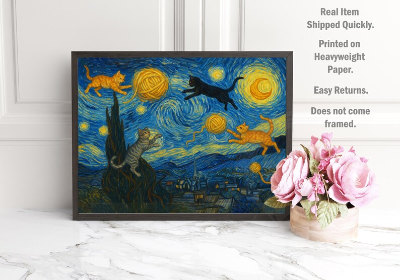 May include: A framed art print depicting a whimsical scene of cats playing with yarn balls against a starry night backdrop. The artwork features orange, black, and gray cats, with yellow yarn balls and a blue and yellow night sky. The print is unframed.