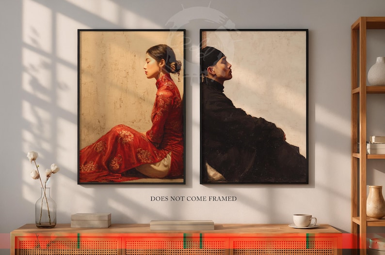 May include: Two framed art prints. One features a person in a red dress, the other a person in black clothing. Both are in profile, set against a neutral background. The text "DOES NOT COME FRAMED" is at the bottom.