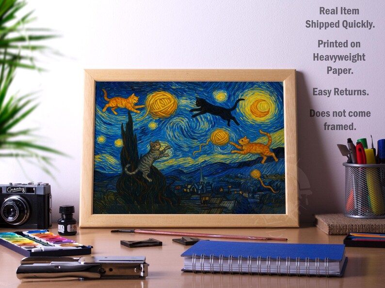 May include: Framed print featuring a whimsical adaptation of Van Gogh's "Starry Night," with cats playing with yarn balls under a swirling blue and yellow sky. The artwork is printed on heavyweight paper.