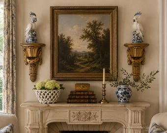 May include: A stone fireplace mantel featuring a landscape painting in a gold frame, flanked by two gold wall sconces topped with white cockatoo figurines. The mantel holds a white lattice bowl with flowers, stacked books, a candle, and a blue vase.