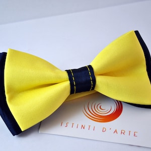 Handmade bow tie for men made up of yellow and blue satin fabric