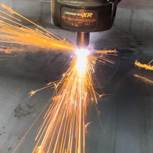 This is our CNC plasma machine cutting our steel metal artwork