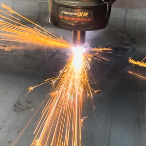 This is our CNC machine cutting out our steel metal cutouts