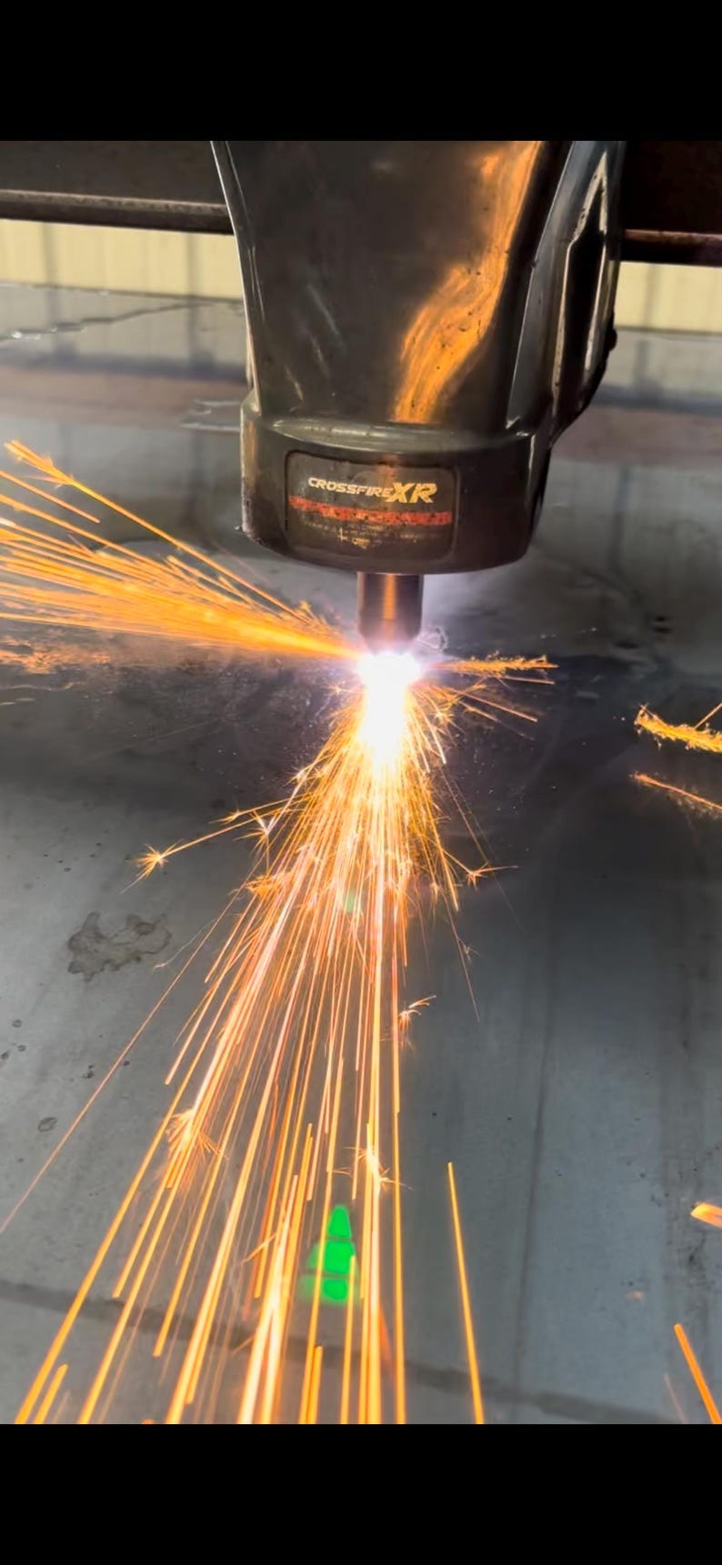 This is our CNC machine cutting out our steel metal cutouts