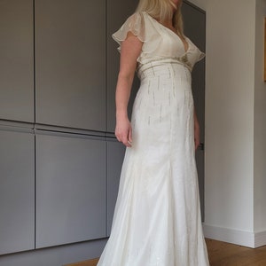 Vintage BHS wedding dress with train. Never worn, still has tag. UK size 12