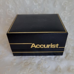 Empty 1984 black with gold trim Accurist Quartz Analogue Watch Box with Guarantee booklet.