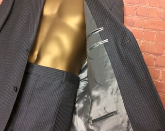 Vintage Aquascutum grey pinstriped two piece men's suit. Jacket and trousers size 38L.