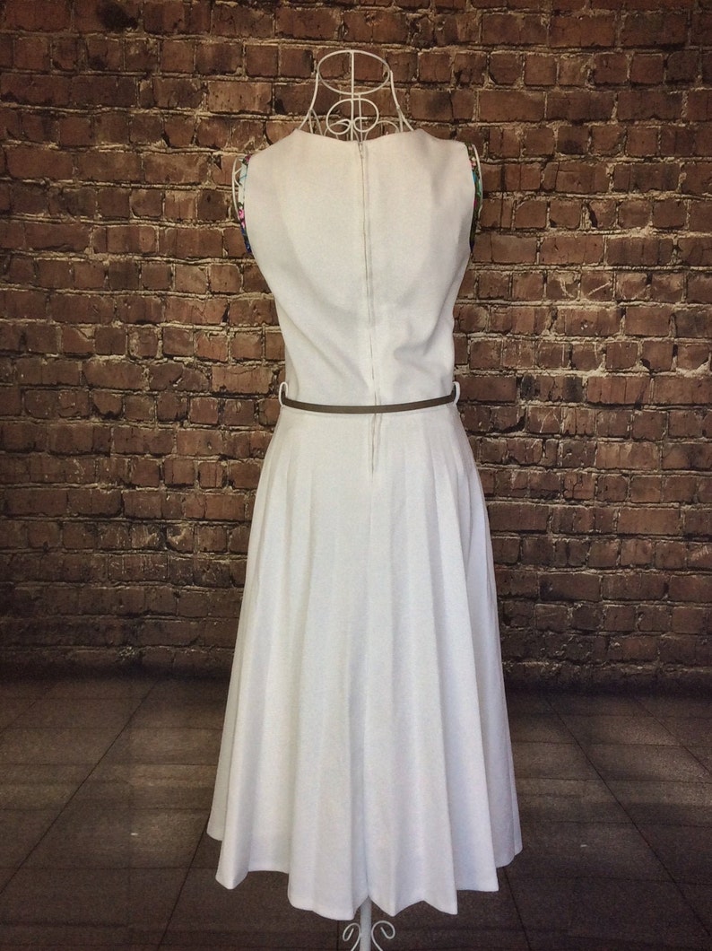 UK 8 Size X Small 1950s Crimplene dress with pleated skirt and belt