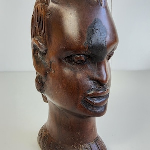 1960s Hand carved dark wood African Tribal head bust. 6 inches tall shelf ornament.