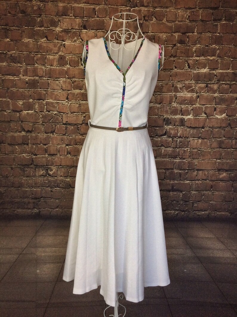 UK 8 Size X Small 1950s Crimplene dress with pleated skirt and belt