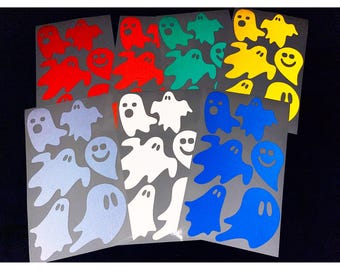 May include: Sheets of colorful ghost stickers in red, green, yellow, blue, white, and light blue. The stickers feature various ghost designs, some with smiling faces. These stickers are ideal for Halloween decorations or craft projects.