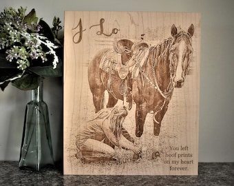 May include: A wooden plaque with a laser-engraved image of a horse and a person. The text "J-Lo" is at the top of the plaque. The text "You left hoof prints on my heart forever." is at the bottom of the plaque.